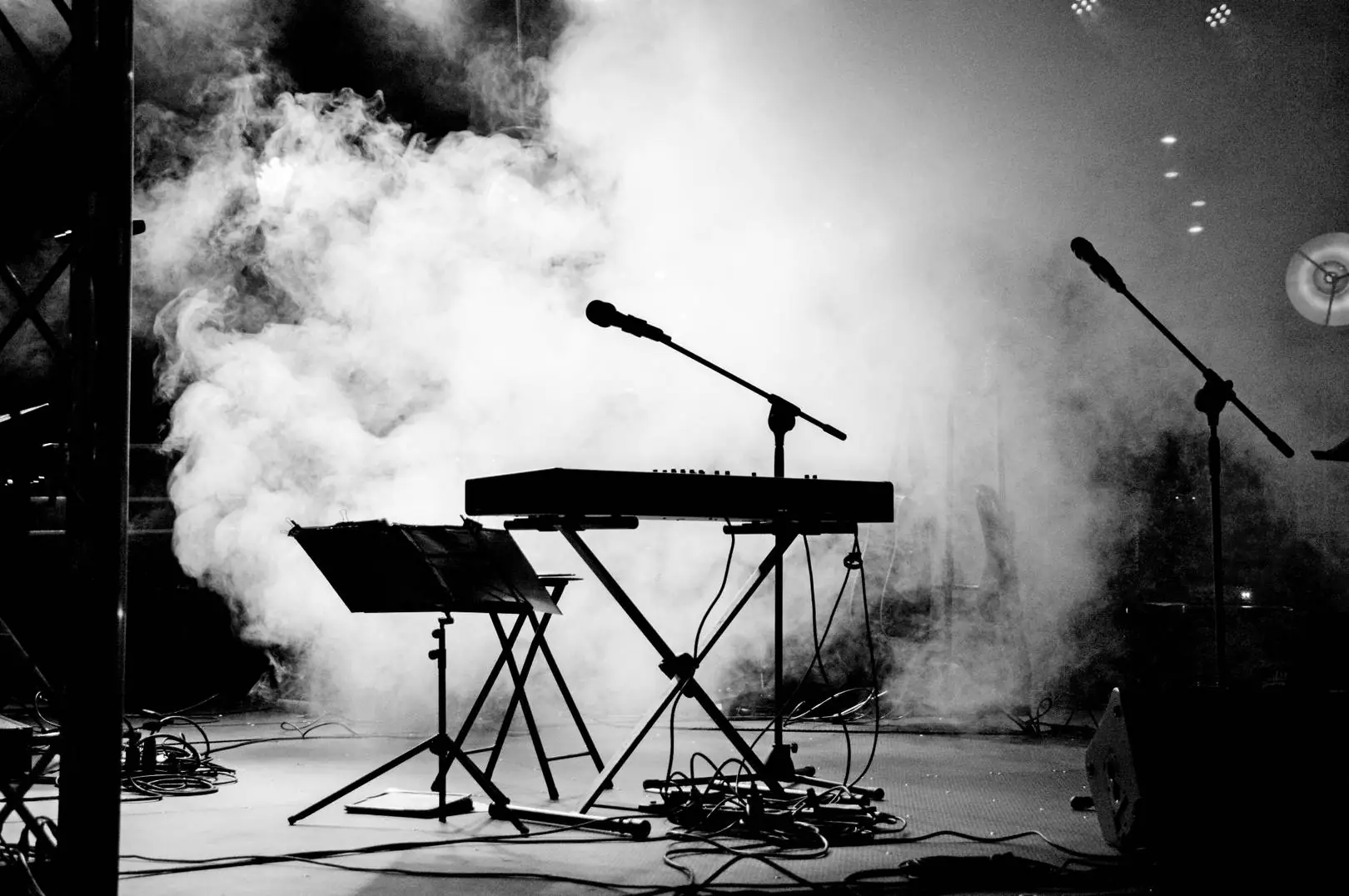 Empty stage with smoke and keyboards