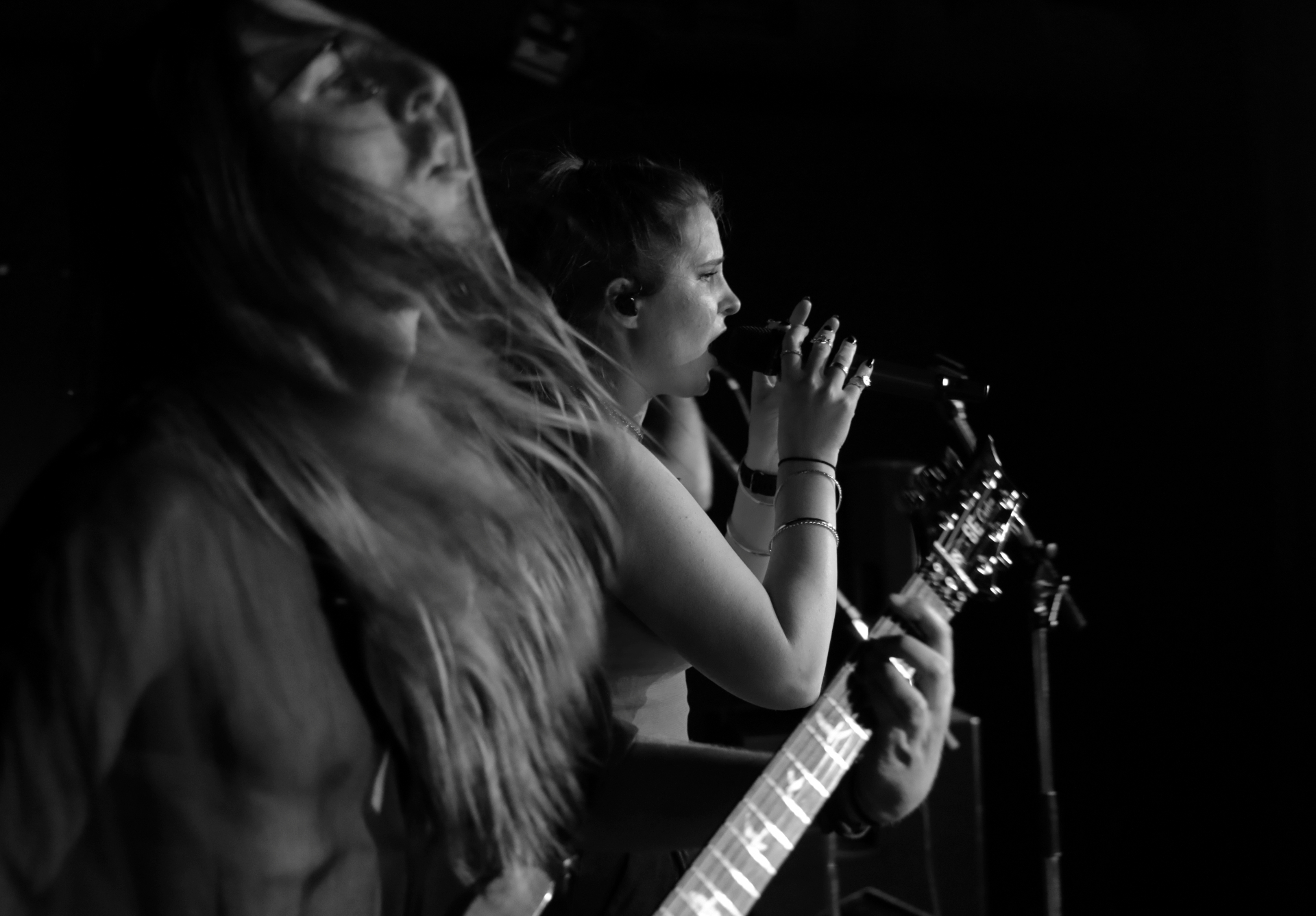 Musicians performing in dark venue